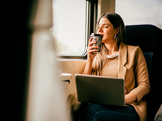 woman-coffee-window-commute-4-3-544x408px