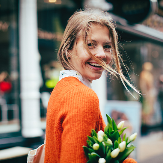 woman-holding-flowers-1-1-544x544px