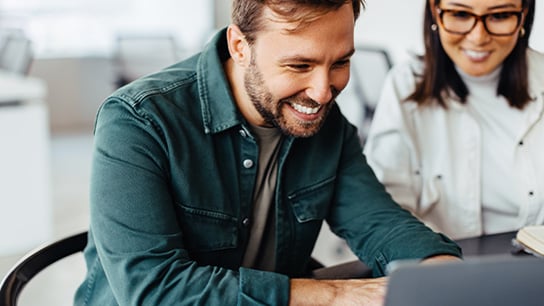 people-office-two-colleagues-laptop-text-image-16-9