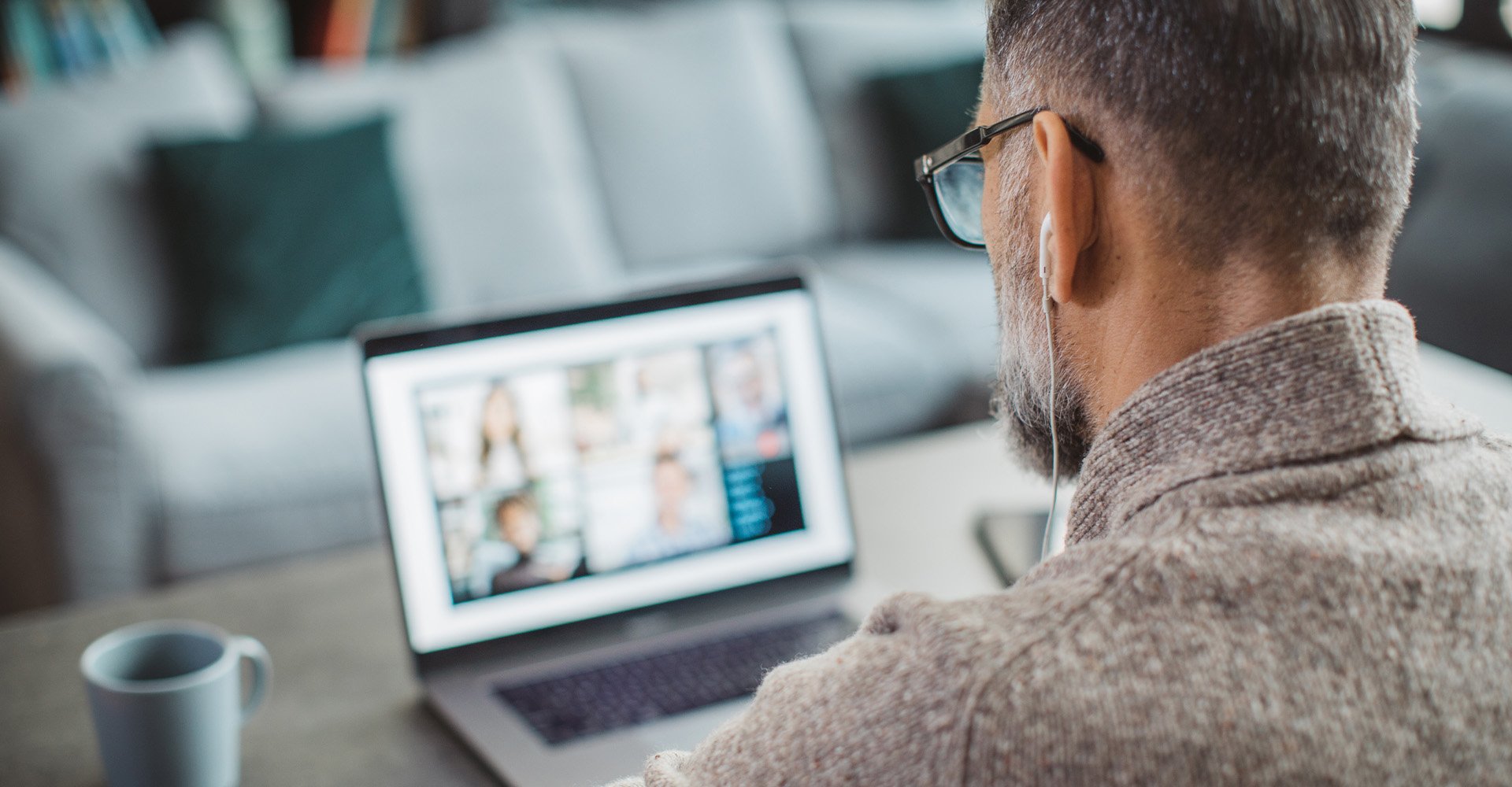 people-home-office-video-meeting-over-shoulder-hero