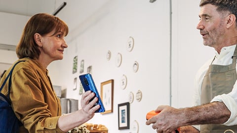 people-payment-buying-phone-turned-2-col-content