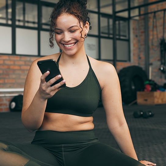 people-phone-sitting-in-gym-hero-foreground