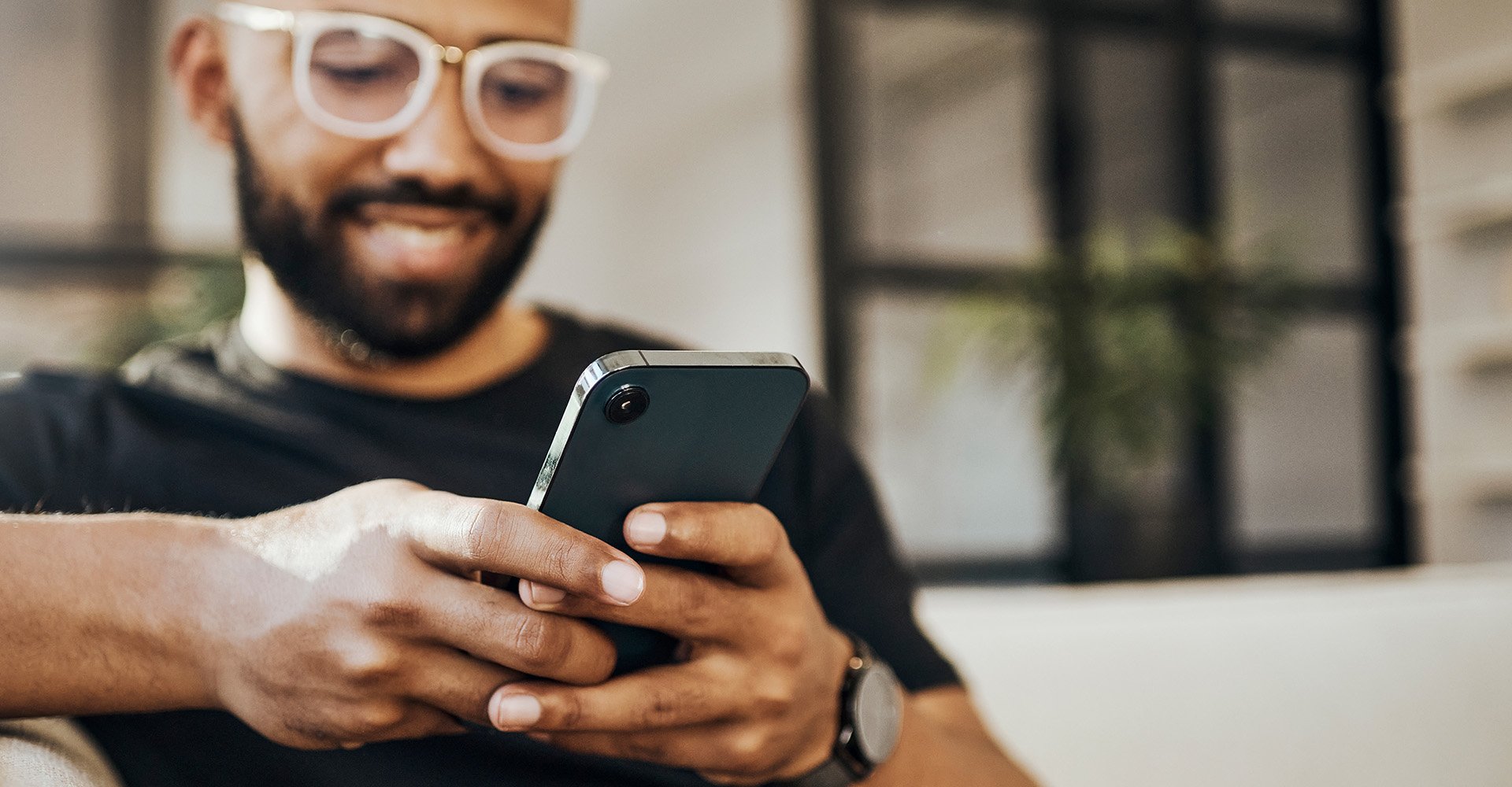 people-phone-sitting-checking-phone-hero