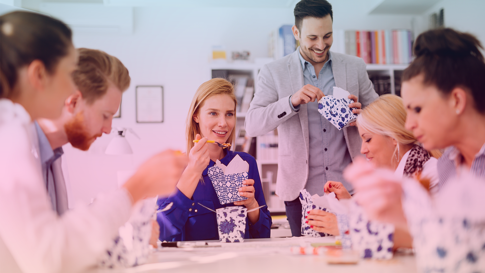 business people eating in office 16x9