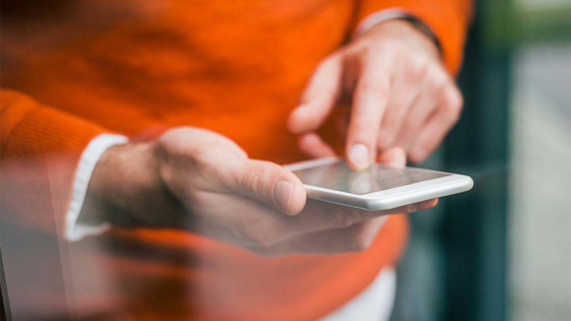 using-phone-by-window-16-9-1120x630px