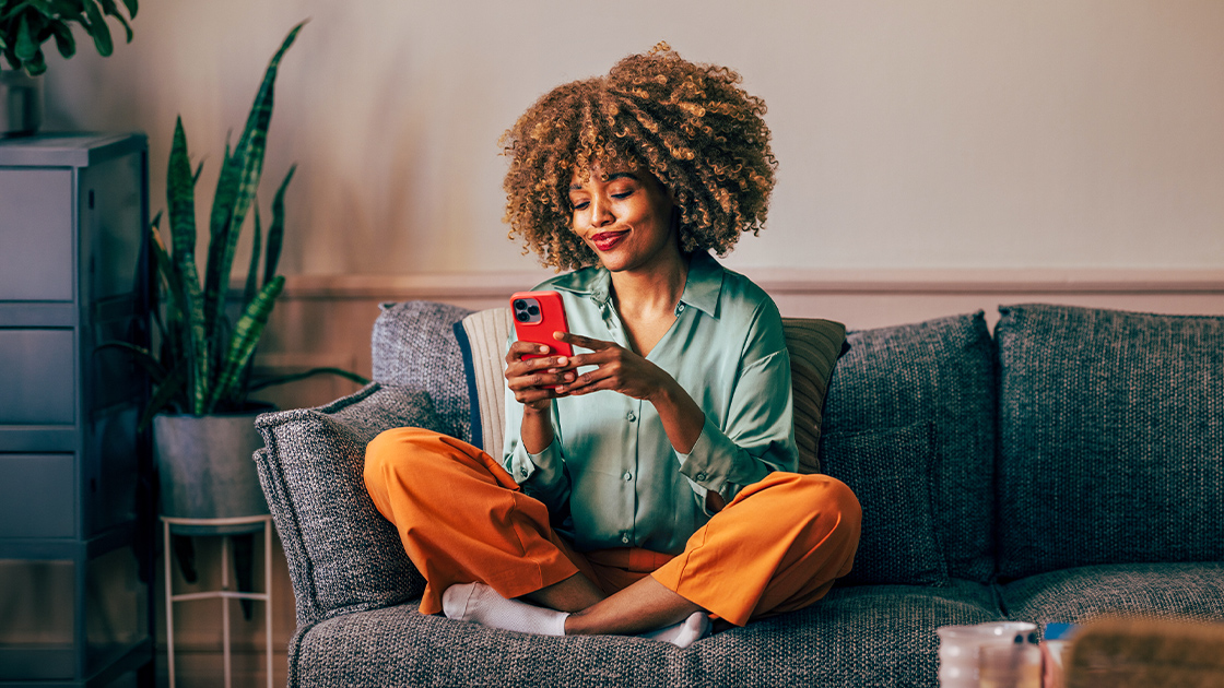 woman-sofa-using-phone-16-9-1120x630px
