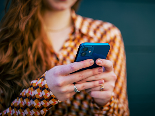 woman-using-phone-closeup-4-3-544x408px