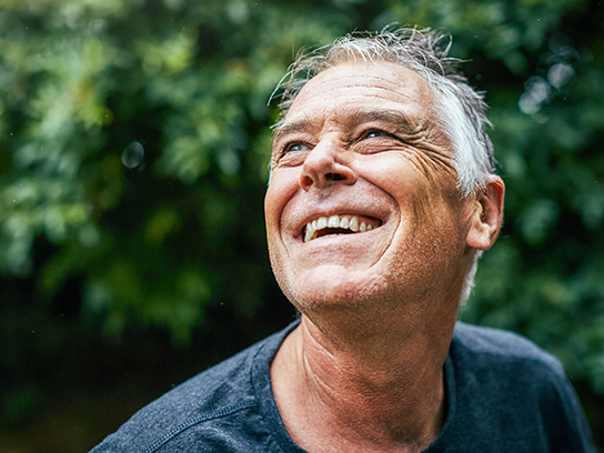 man-smiling-eyes-wellbeing-4-3-544x408px