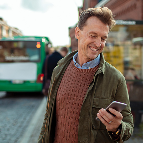 commute-busstop-looking-at-phone-text-image-1-1