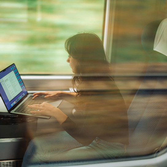 commute-train-working-on-laptop-text-image-1-1