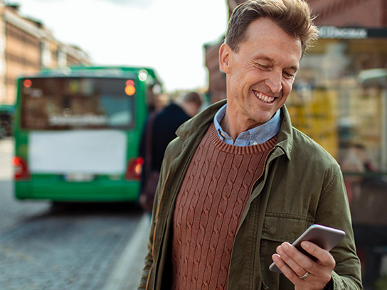 commute-busstop-looking-at-phone-text-image-4-3