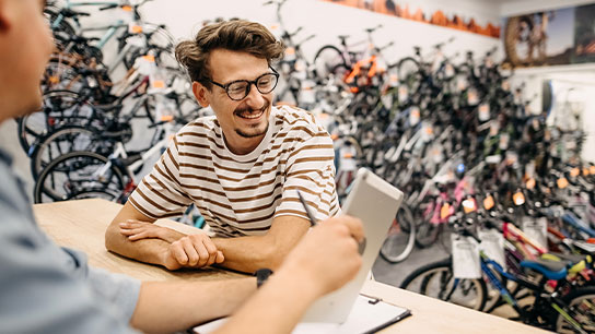 bike-shop-showroom-bicycles-customer-staff-purchase-text-image-16-9