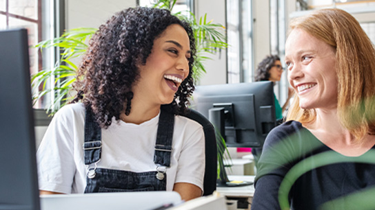 people-office-colleagues-smiling-desk-text-image-16-9